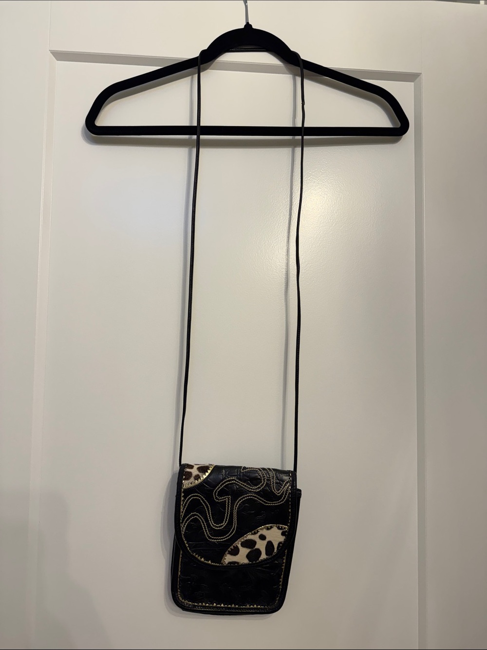 Carlos Falchi Black Leather Crossbody with Cowhide Spot Accent. Western design.